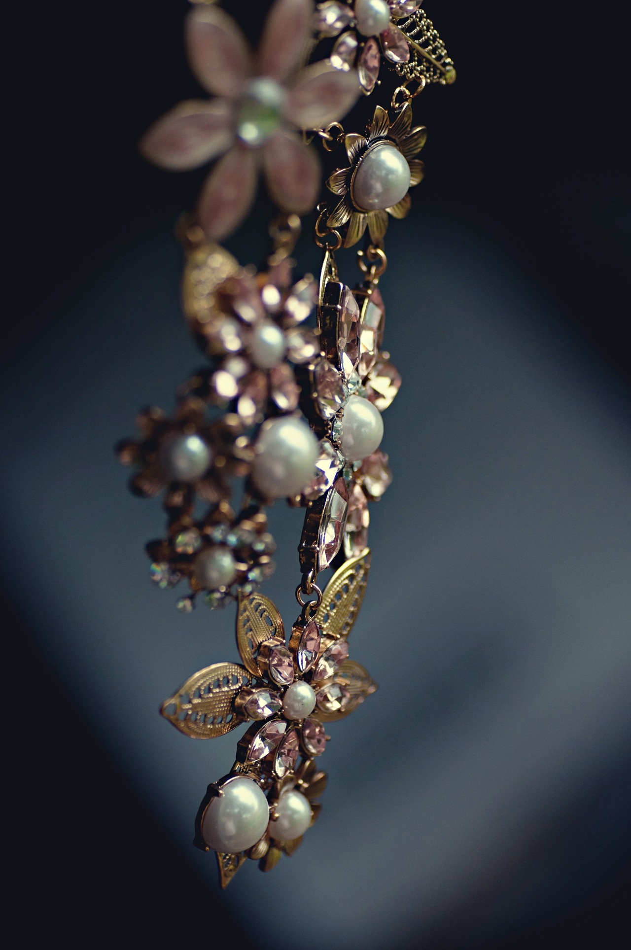 A piece of dangling pearl floral jewelry